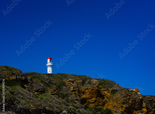 Lighthouse with blue sky in background
