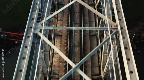 Aerial view of a drone on a railway metal bridge
