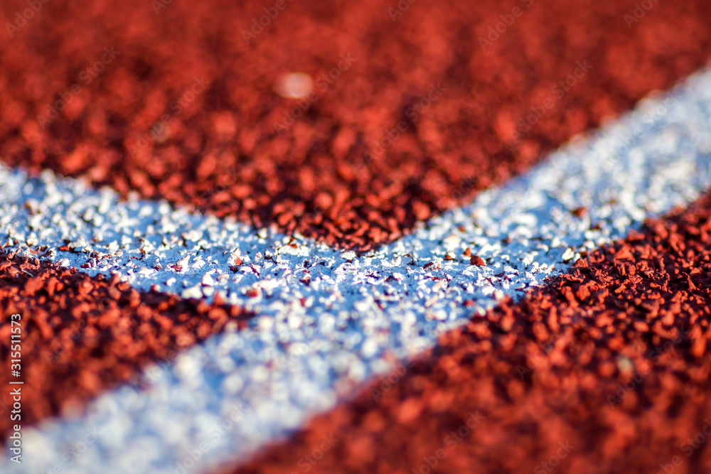 Red running sport track background and texture. Sport running track concept. Red running sport track background and texture. Sport running track concept.