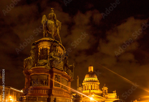 An night time shot of Saint Isaac Cathedral of St Petersburg with monument of Nicholas