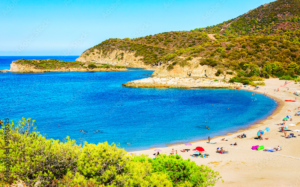 Landscape of Chia Beach and Blue Waters of the Mediterranean Sea in Province of Cagliari in South Sardinia in Italy. Scenery and nature. Mixed media. Landscape of Chia Beach and Blue Waters of the Mediterranean Sea in Province of Cagliari in South Sardinia in Italy. Scenery and nature. Mixed media.