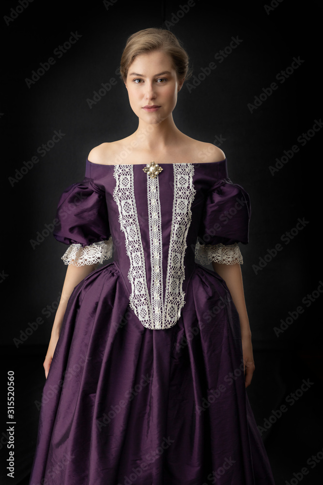 Renaissance or Victorian woman on a dark backdrop Renaissance or Victorian woman on a dark backdrop
