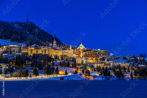View of St. Moritz town in Switzerland at night in winter photo