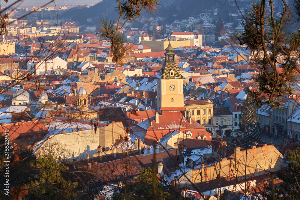 Brasov Council Square at sunset, in Winter - view from a viewpoint above the city.