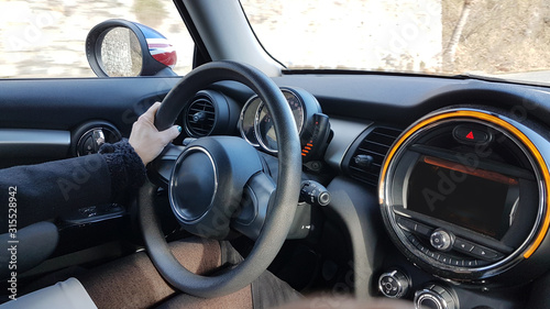 steering wheel drivers hands and modern black car © sea and sun