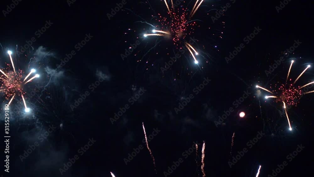 Beautiful abstract colourful Fireworks explode display on sky at night a symbol of celebration in New years anniversary for background