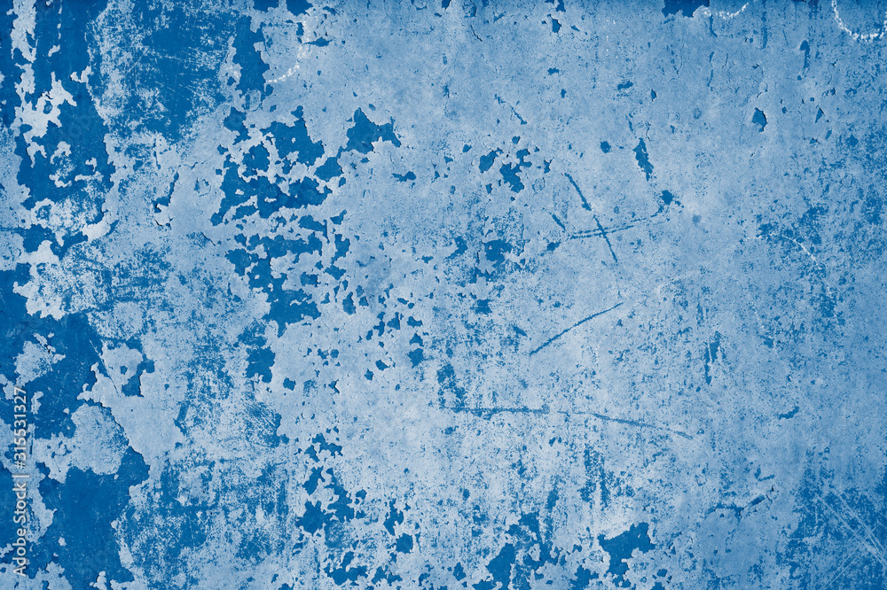 Fototapeta premium Plastered wall with peeling paint in red, biue and pink colors in classic blue trendy color of the year 2020