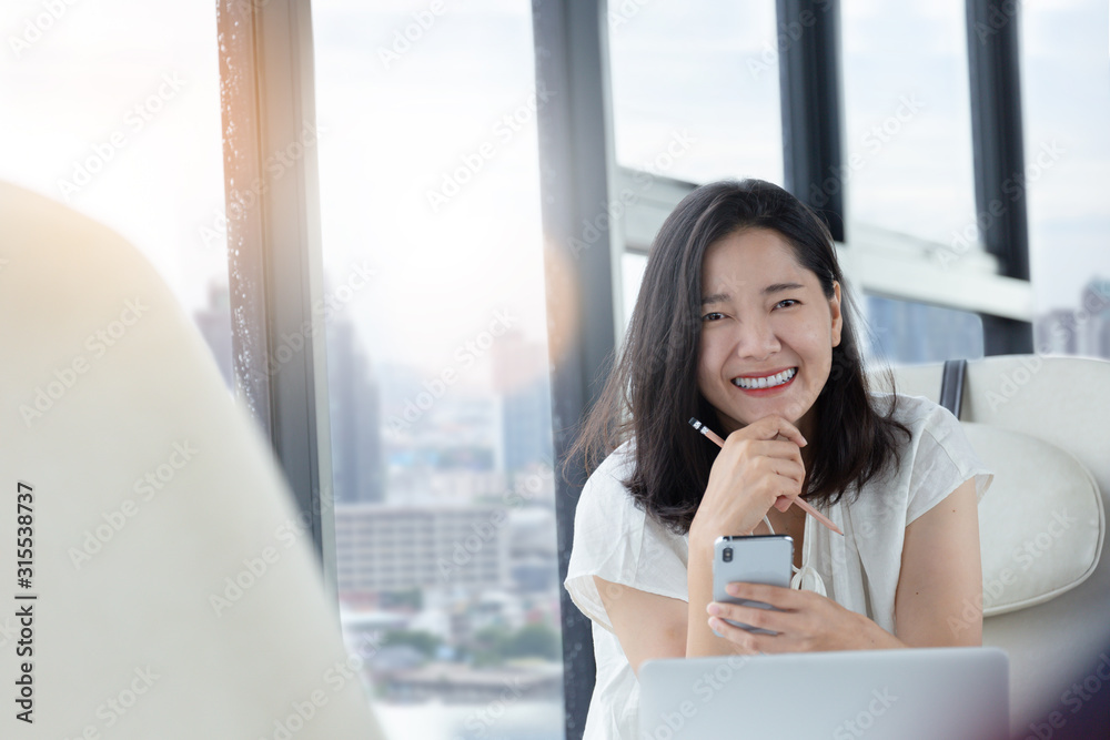 using cell phone.hand holding texting message on screen mobile chatting friend ,search internet information sitting on sofa in office.technology device contact communication connecting people concept using cell phone.hand holding texting message on screen mobile chatting friend ,search internet information sitting on sofa in office.technology device contact communication connecting people concept
