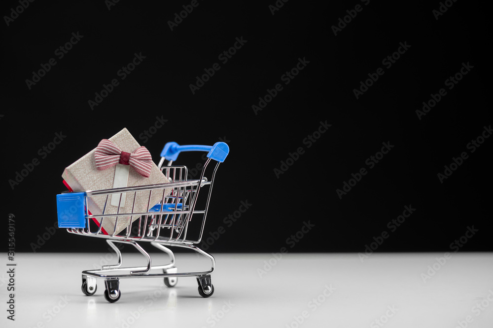 Mini Shoping cart with small gift box concept shoping.