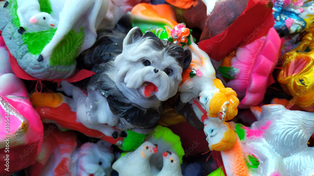 a wax toys dog put with other toy on toy shop