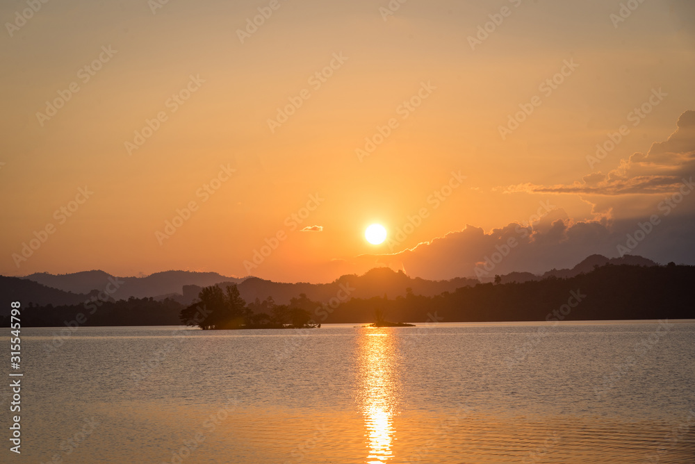 sunset over the river in KHAO LAM dam in Thailand