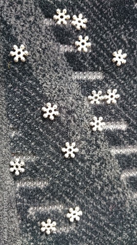 Silver steel star flowers on multi-gray upholstery