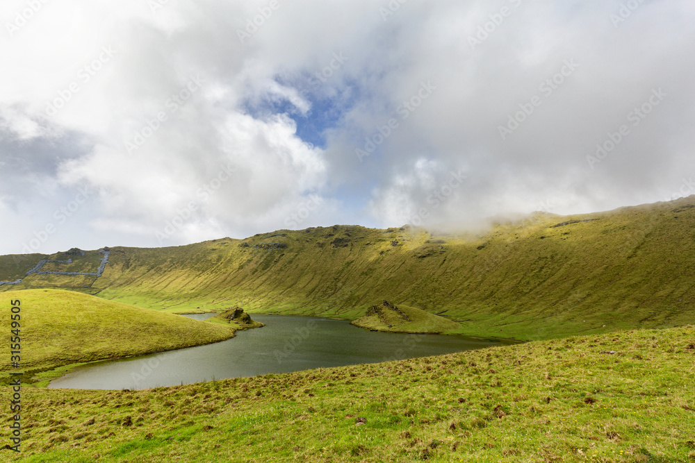 Obraz premium A fresh water lake at the center of the Corvo caldera on the island of Corvo in the Azores, Portugal.