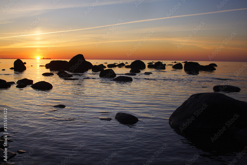 Stone coast of the Baltic Sea at sunrise
