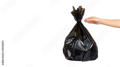 Black plastic trash bag, tied junk pack, garbage package. © Sviatoslav Kovtun