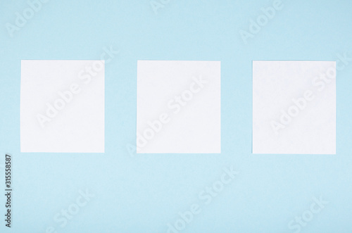 Paper notes composition on blue background. Flat lay.