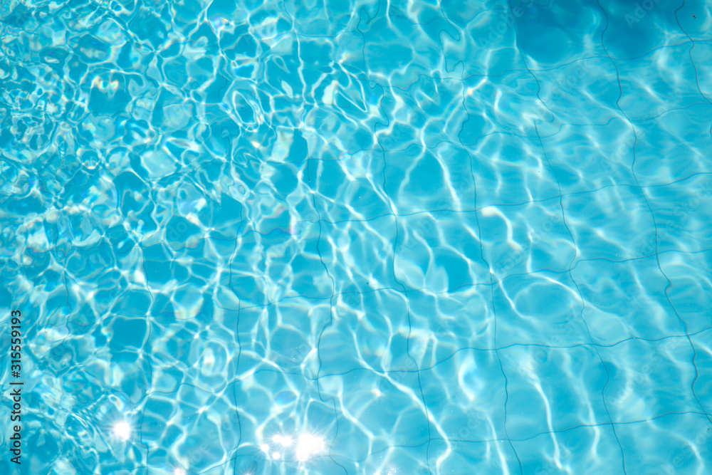 ripped water in swimming pool .surface of blue swimming pool,background of water in swimming pool.
