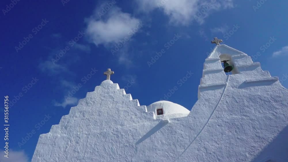 Static shot of a typical whitewashed Greek church looking up to the ...