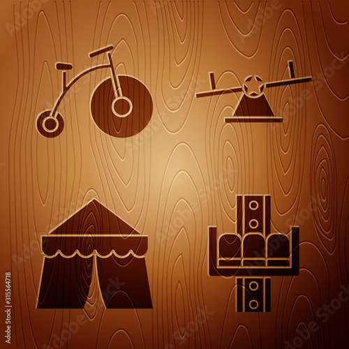 Set Attraction carousel, Vintage bicycle with one big wheel and one small, Circus tent and Seesaw on wooden background. Vector