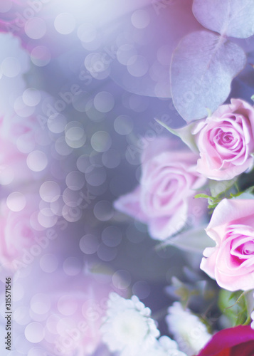 Delicate floral background with copy space under the text. Blurred background with spring flowers  bokeh. Bouquet of flowers close-up