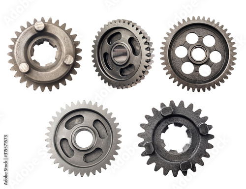 Old metal gear wheel or pinion part , Motorcycle Gear driven gear reduction ratio isolated on white background.