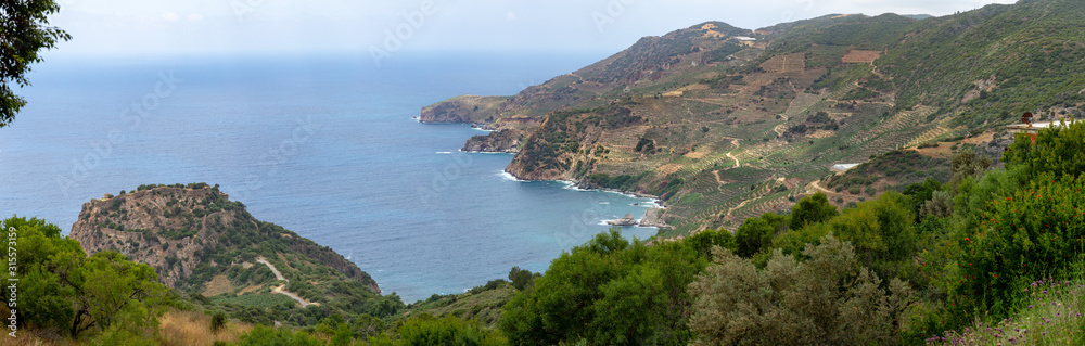 Sea bay area with mountain landscape used as banana farming soil. Panorama in high resolution.
