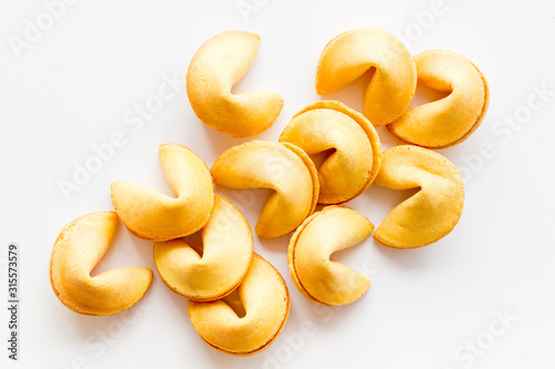 Traditional fortune cookies on white table top-down