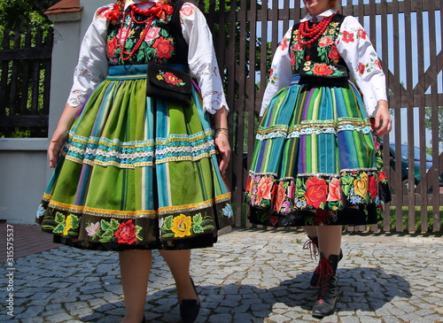 two Polish girls in traditional folk costumes from lowicz region