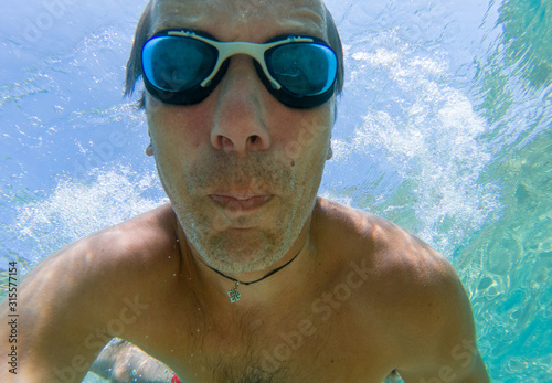 Underwater selfie shot of a swimmer in the sea