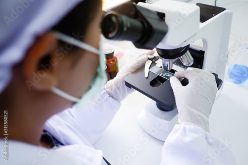 Cropped shot view of  the equipment and science experiments in Laboratory, Chemical substances for research and analyzing a sample under the microscope in laboratory.   