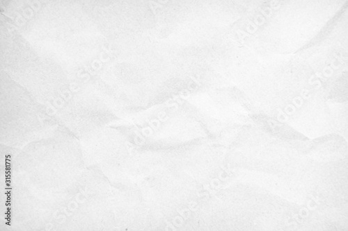 White recycled craft paper texture as background. Grey paper texture, Old vintage page or grunge vignette of old newspaper. Pattern rough art creased grunge letter. Hardboard with copy space for text.
