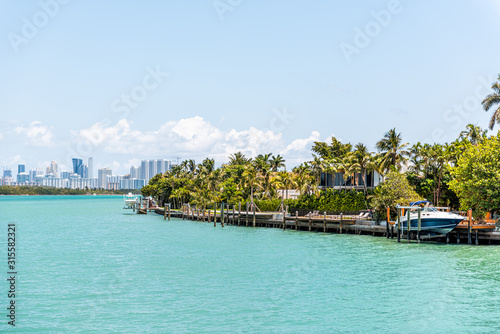 Bal Harbour, Miami Florida with light green turquoise ocean Biscayne Bay Intracoastal water and cityscape skyline of Sunny Isles Beach photo