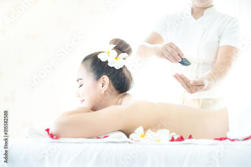Beautiful woman in spa. Spa oil massage for relaxation. Asian woman in wellness beauty spa having aroma therapy massage with essential oil. Thailand.