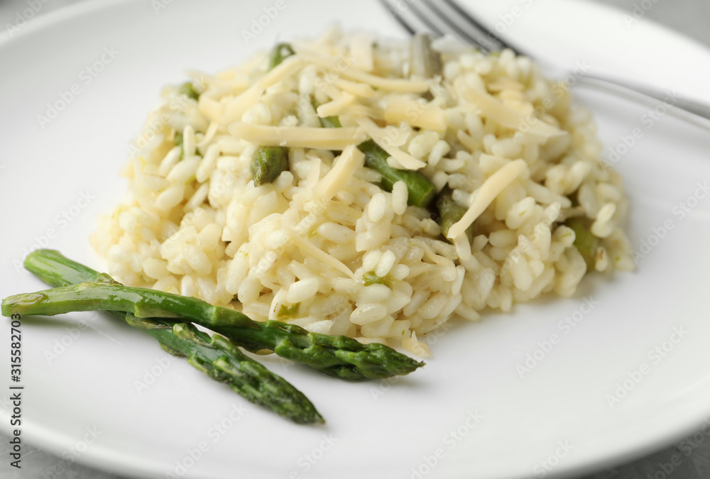 Delicious risotto with asparagus in plate, closeup Delicious risotto with asparagus in plate, closeup