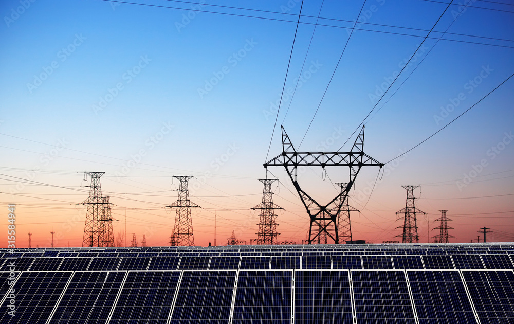 Solar photovoltaic panels and pylons in the evening