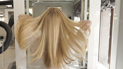 Woman with Healthy Long Blond Hair. Female Fluttering Fair Hair