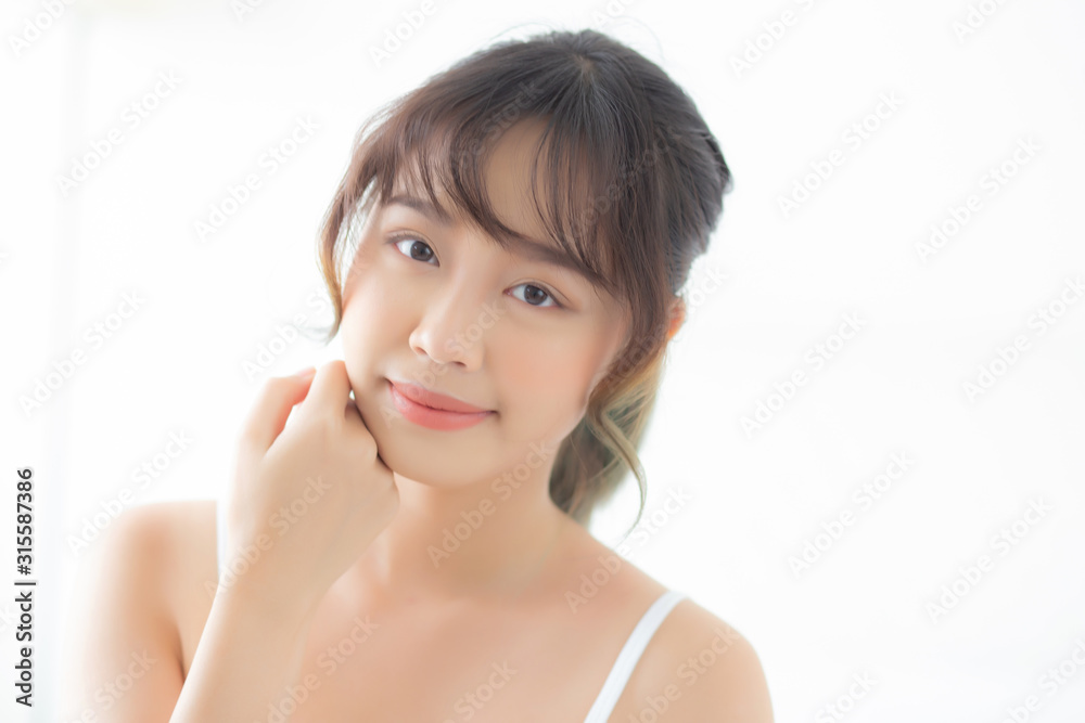 Portrait of beautiful young asian woman smile while wake up healthy and wellness with sunrise at morning in the bedroom, asia girl skin care with happy with fresh, lifestyle and relax concept. Portrait of beautiful young asian woman smile while wake up healthy and wellness with sunrise at morning in the bedroom, asia girl skin care with happy with fresh, lifestyle and relax concept.