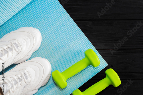 dumbbell sneakers on a bright background. Healthy lifestyle