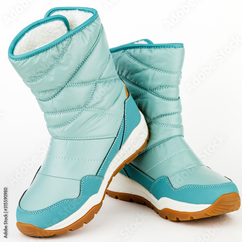 child winter blue boots on a white background photo