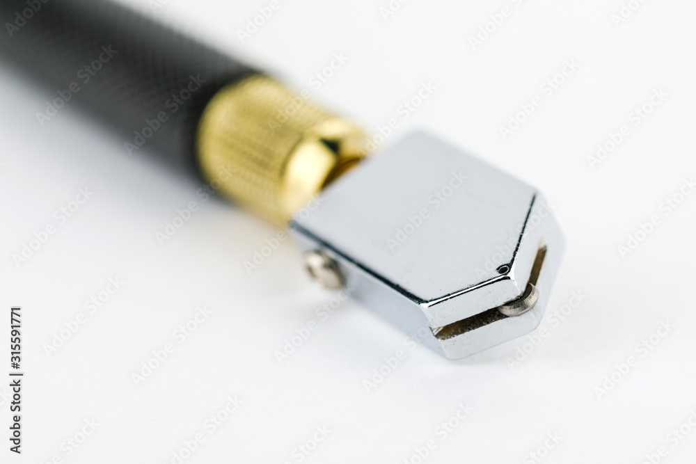 Roller point glass cutter on white background. Tool for cutting glass. Roller point glass cutter on white background. Tool for cutting glass.