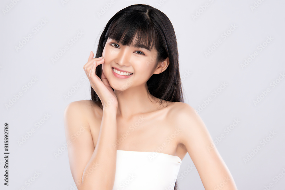 Portrait beautiful young asian woman clean fresh bare skin concept. Asian girl beauty face skincare and health wellness, Facial treatment, Perfect skin, Natural make up, on white background Portrait beautiful young asian woman clean fresh bare skin concept. Asian girl beauty face skincare and health wellness, Facial treatment, Perfect skin, Natural make up, on white background