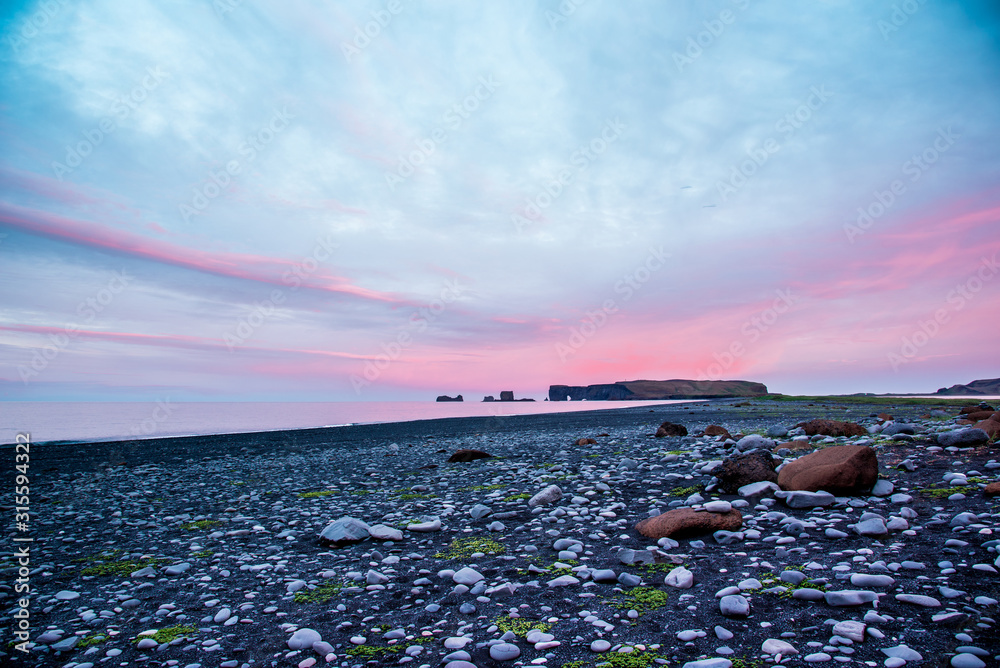 majestic view from the black sand beach on Reynisdrangar Sea Cliffs at dawn on cape Dyrholaey near Vik, Iceland. Exotic countries. Amazing places.