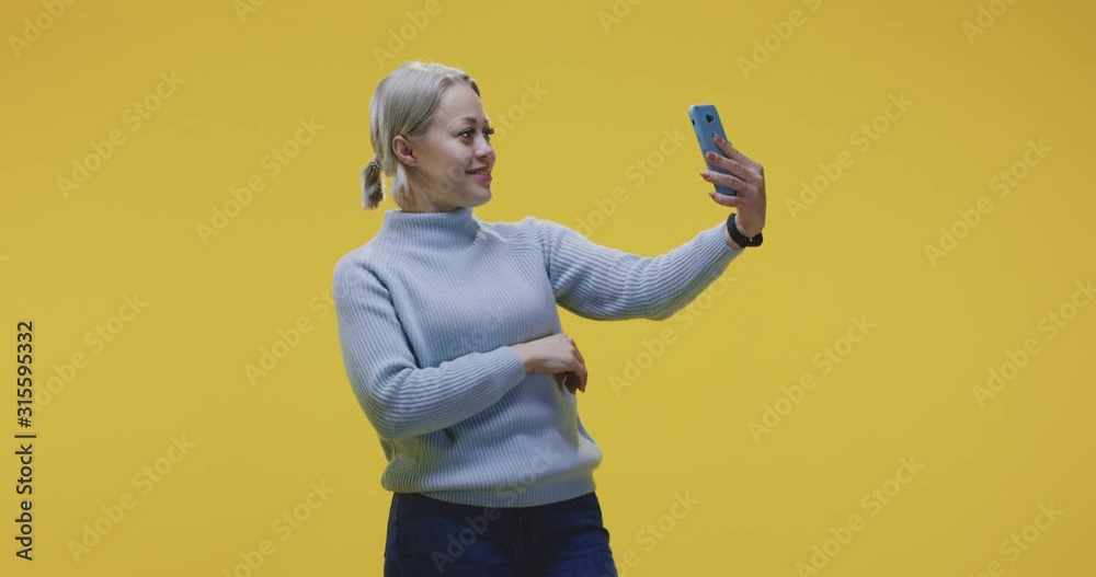 Woman video chatting with smartphone Woman video chatting with smartphone