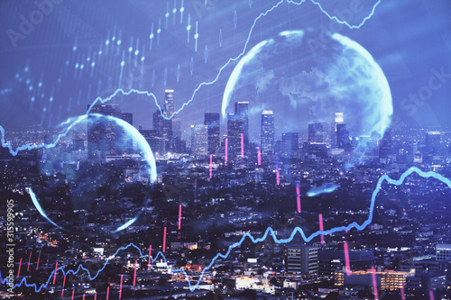 Financial graph on night city scape with tall buildings background double exposure. Analysis concept. © peshkova
