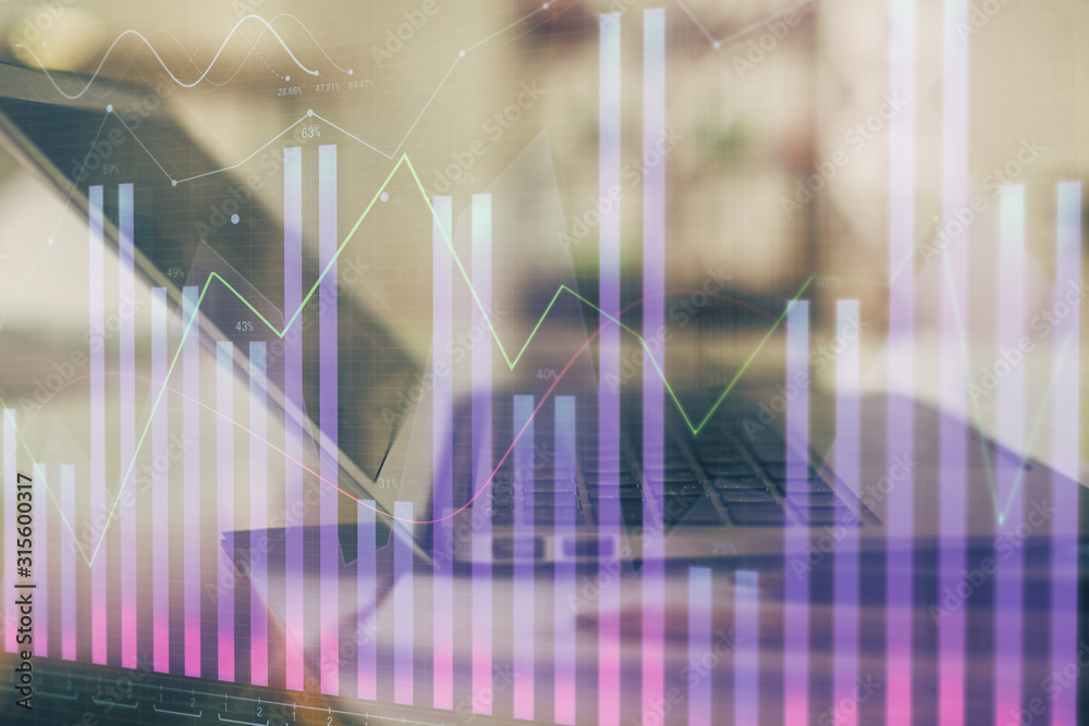 Forex graph hologram on table with computer background. Double exposure. Concept of financial markets. Forex graph hologram on table with computer background. Double exposure. Concept of financial markets.