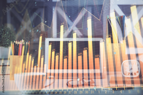 Financial market graph hologram and personal computer on background. Double exposure. Concept of forex.