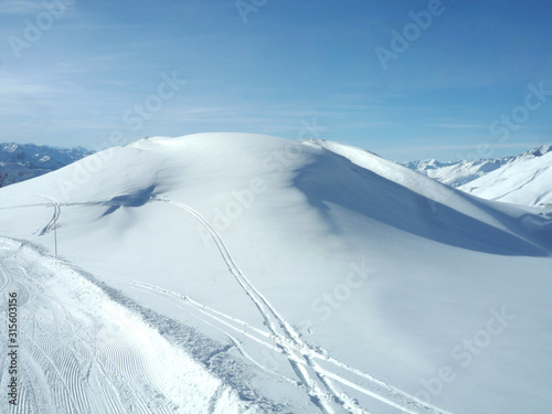 ski and snowboard track in powder snow with copy space for your text