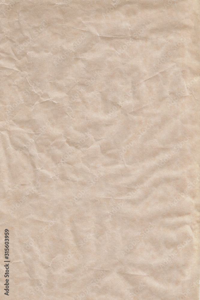Empty sheet brown crumpled wrapping or parchment paper. Texture or background. Space for design or text. Soft focus. Top view. Empty sheet brown crumpled wrapping or parchment paper. Texture or background. Space for design or text. Soft focus. Top view.