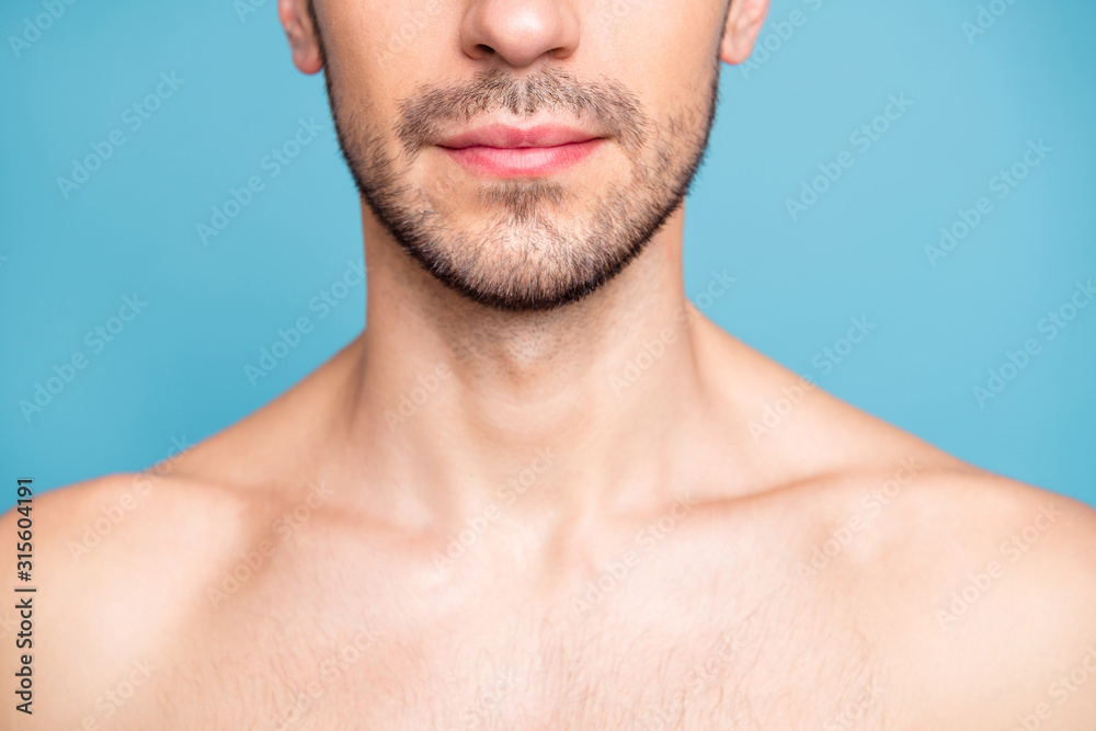 Obraz premium Cropped photo of naked serious man with beard caring about his skin treating it well isolated over blue pastel color background