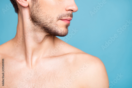 Cropped photo of naked attractive handsome man with face unshaven isolated over pastel blue color background